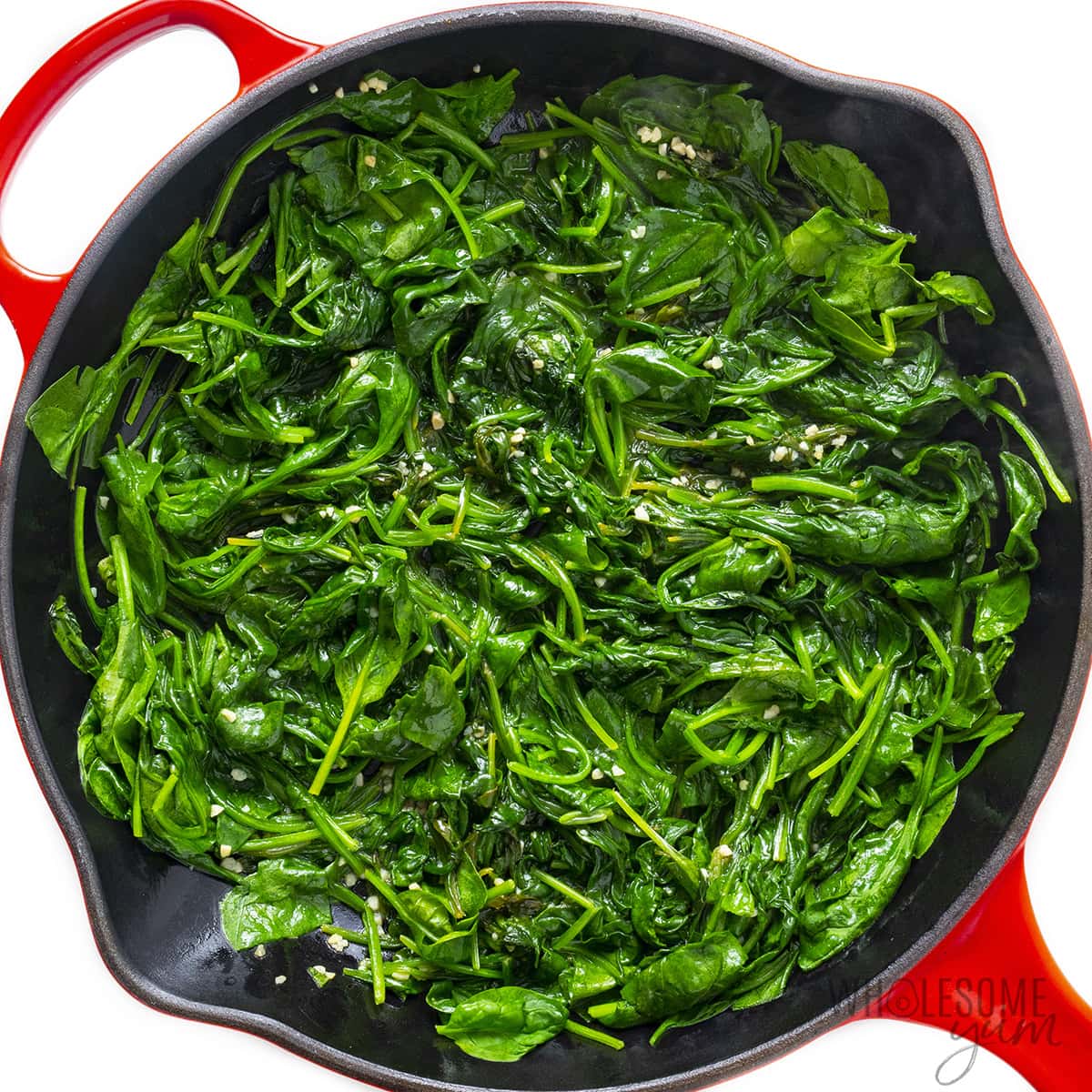 Cooked spinach in a pan.
