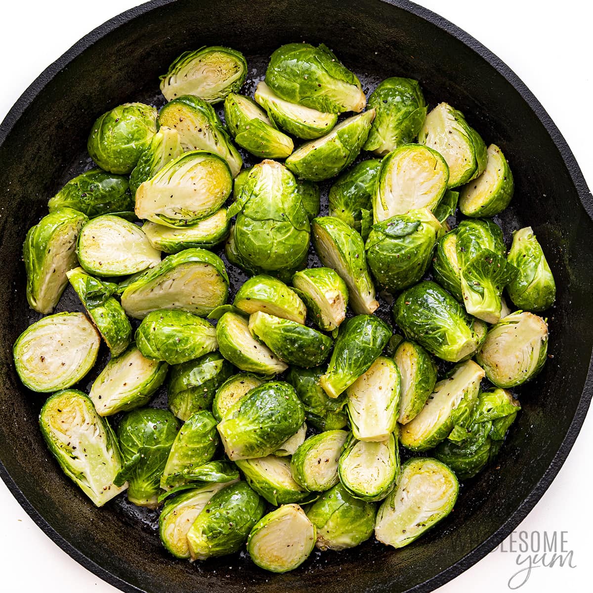 Season the Brussels sprouts in the skillet.