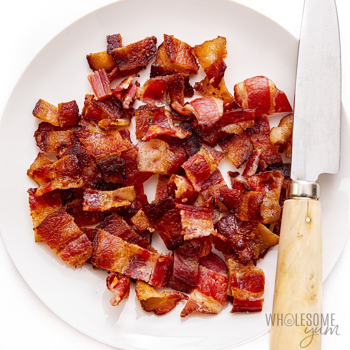 Place chopped bacon on a plate.
