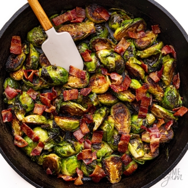 Fried brussel sprouts sauteed in skillet.