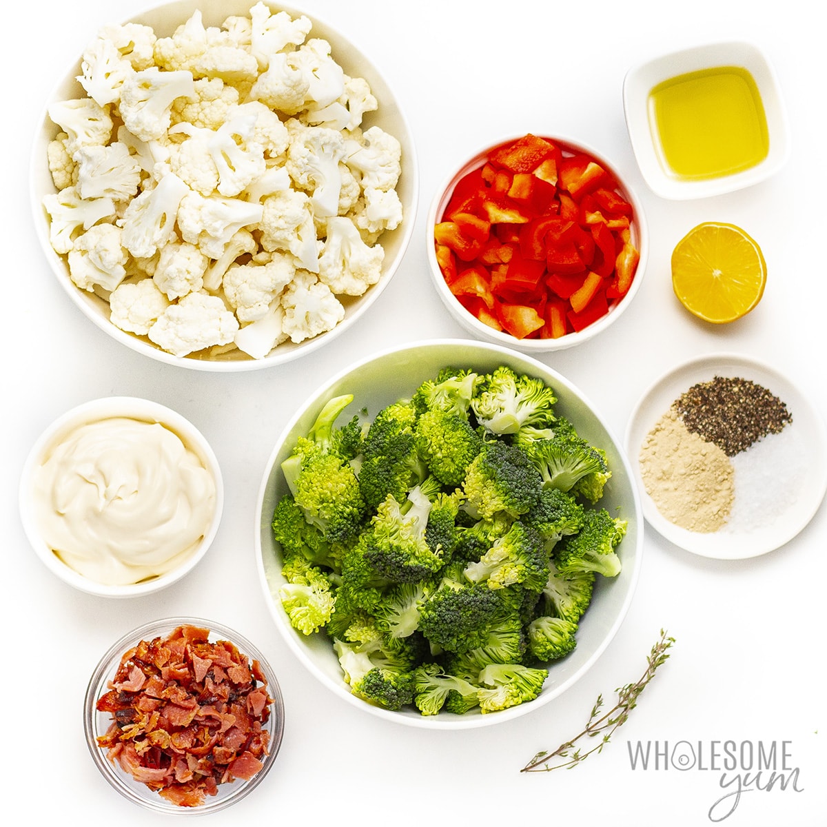 Broccoli cauliflower salad recipe ingredients in bowls.