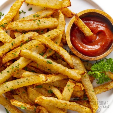 Jicama fries on a plate with ketchup.