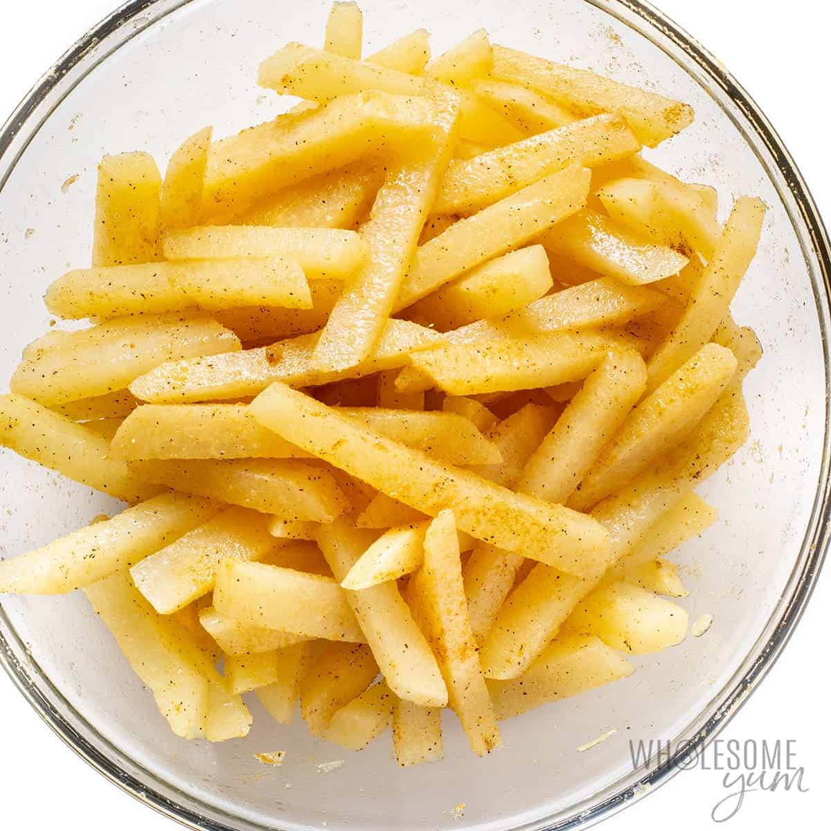 Seasoned jicama fries in a bowl.