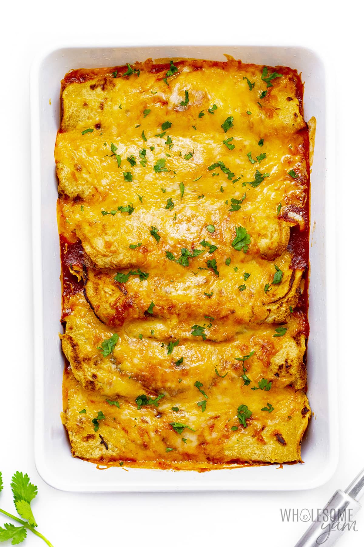 Baked low-carb chicken enchiladas in a griddle.
