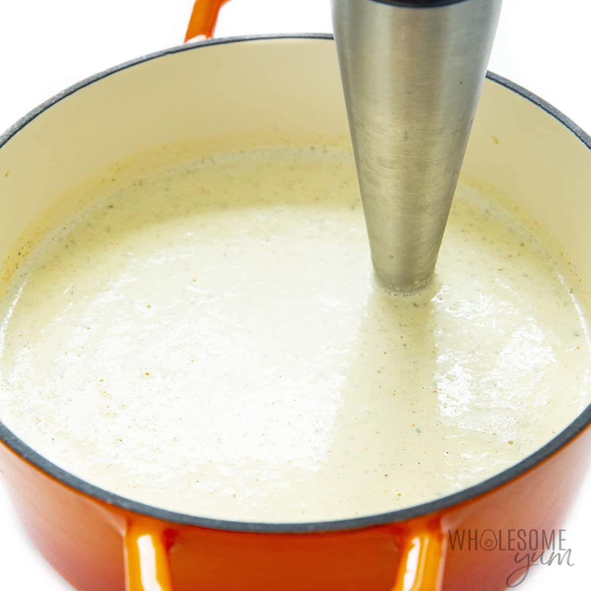 Use an immersion blender to blend the soup.