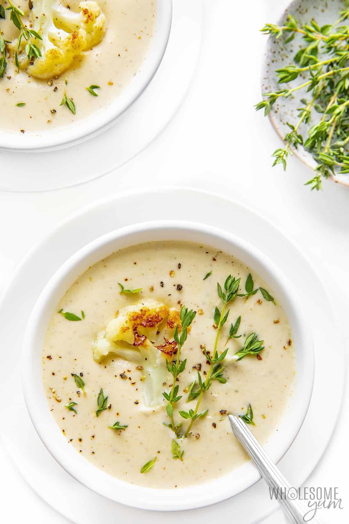Creamy cauliflower soup in bowls