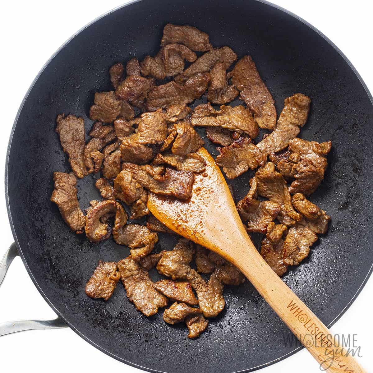 Skillet with stir fried steak.
