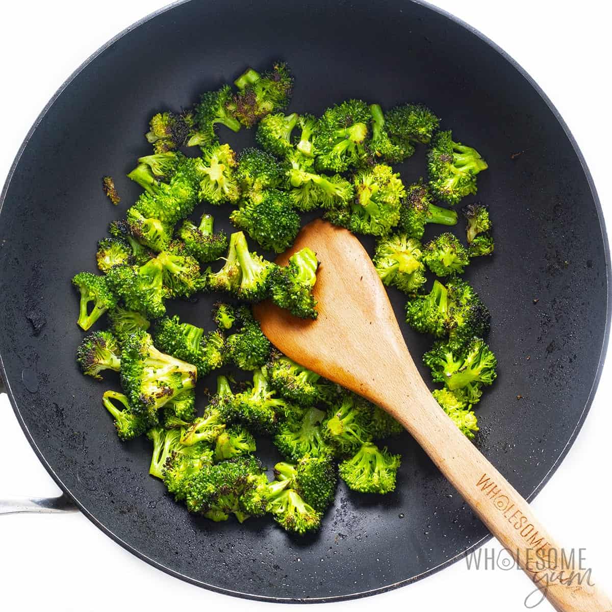 Stir fried broccoli in skillet.