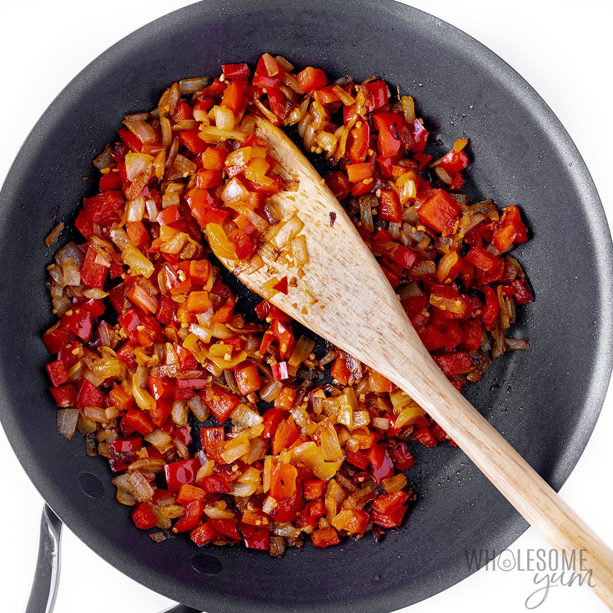 Vegetables sauteed in a skillet.