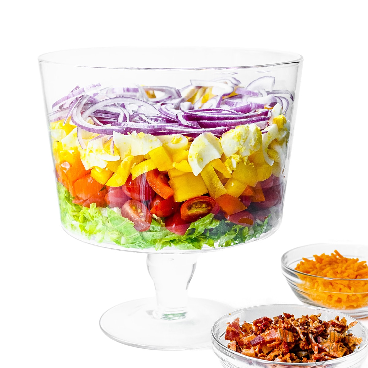 Veggies layered in a trifle bowl.