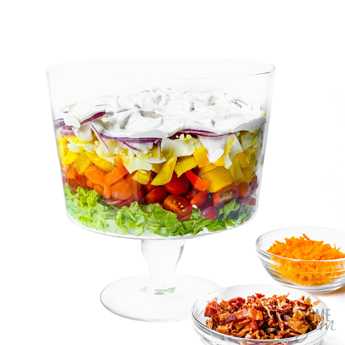 7 layer salad topped with mayo dressing.