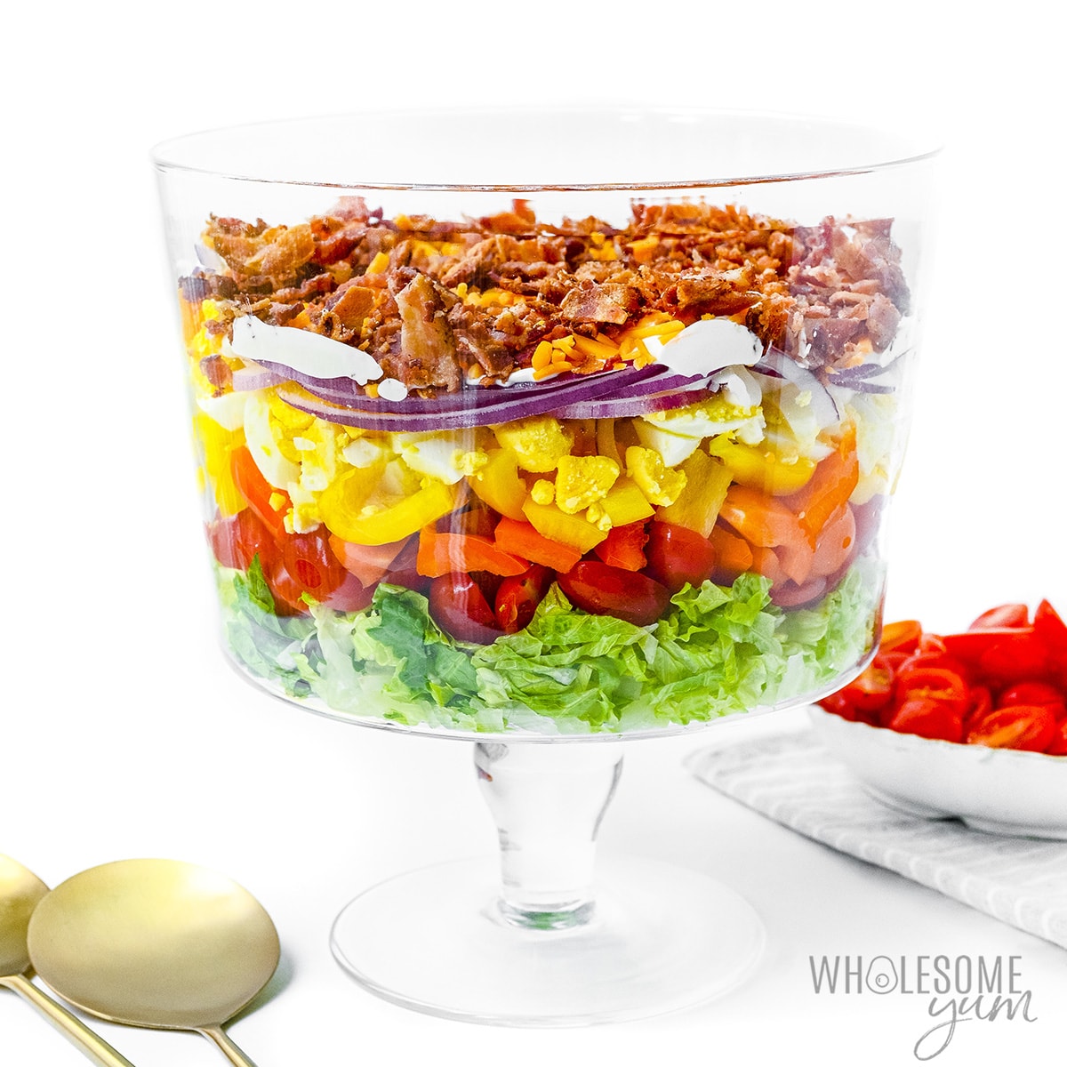 7 layer salad in trifle bowl.