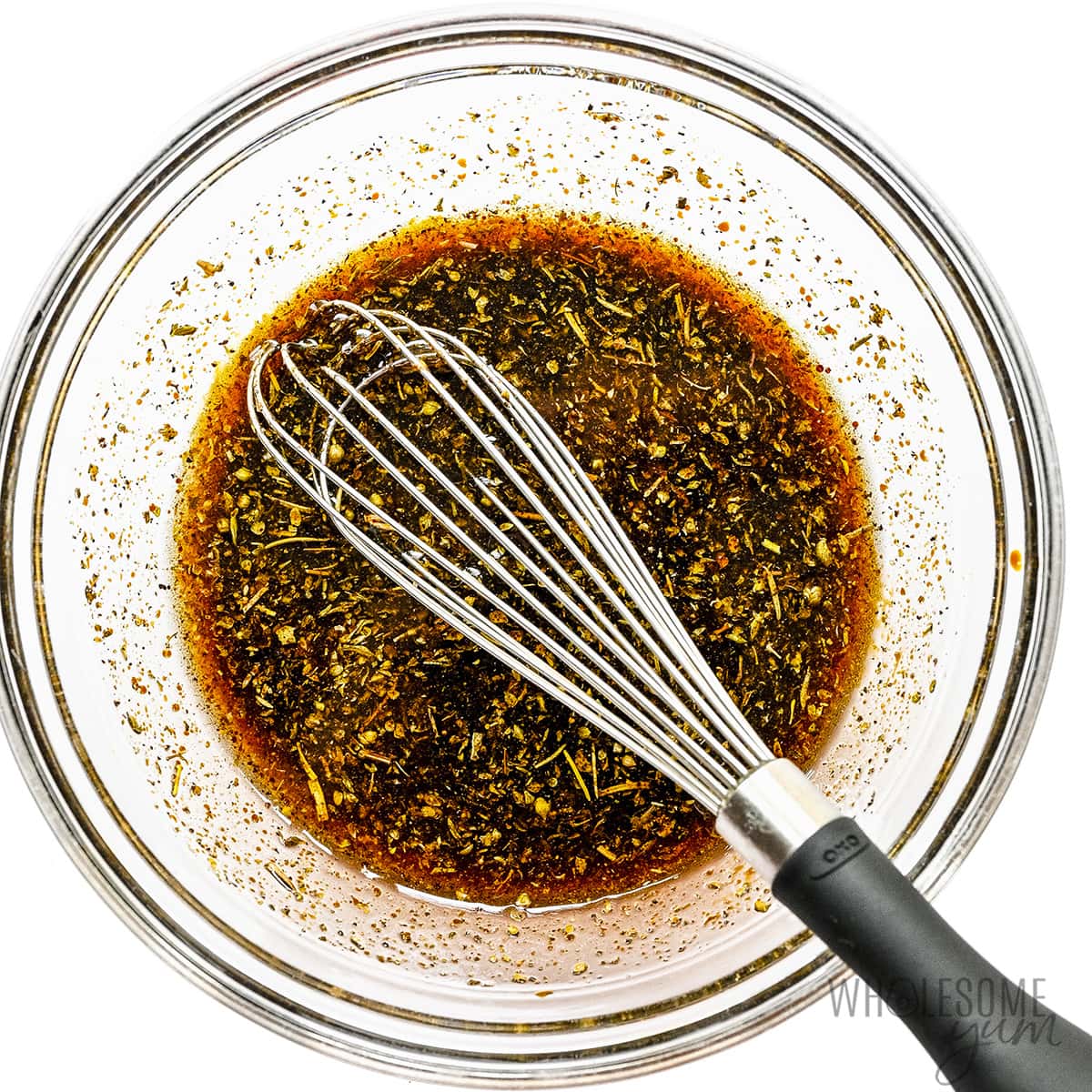 Marinade for steak whisked together in a bowl.