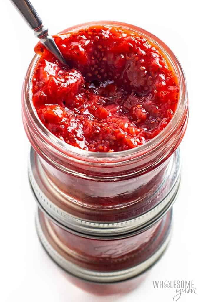 A stack of jars filled with keto strawberry jam