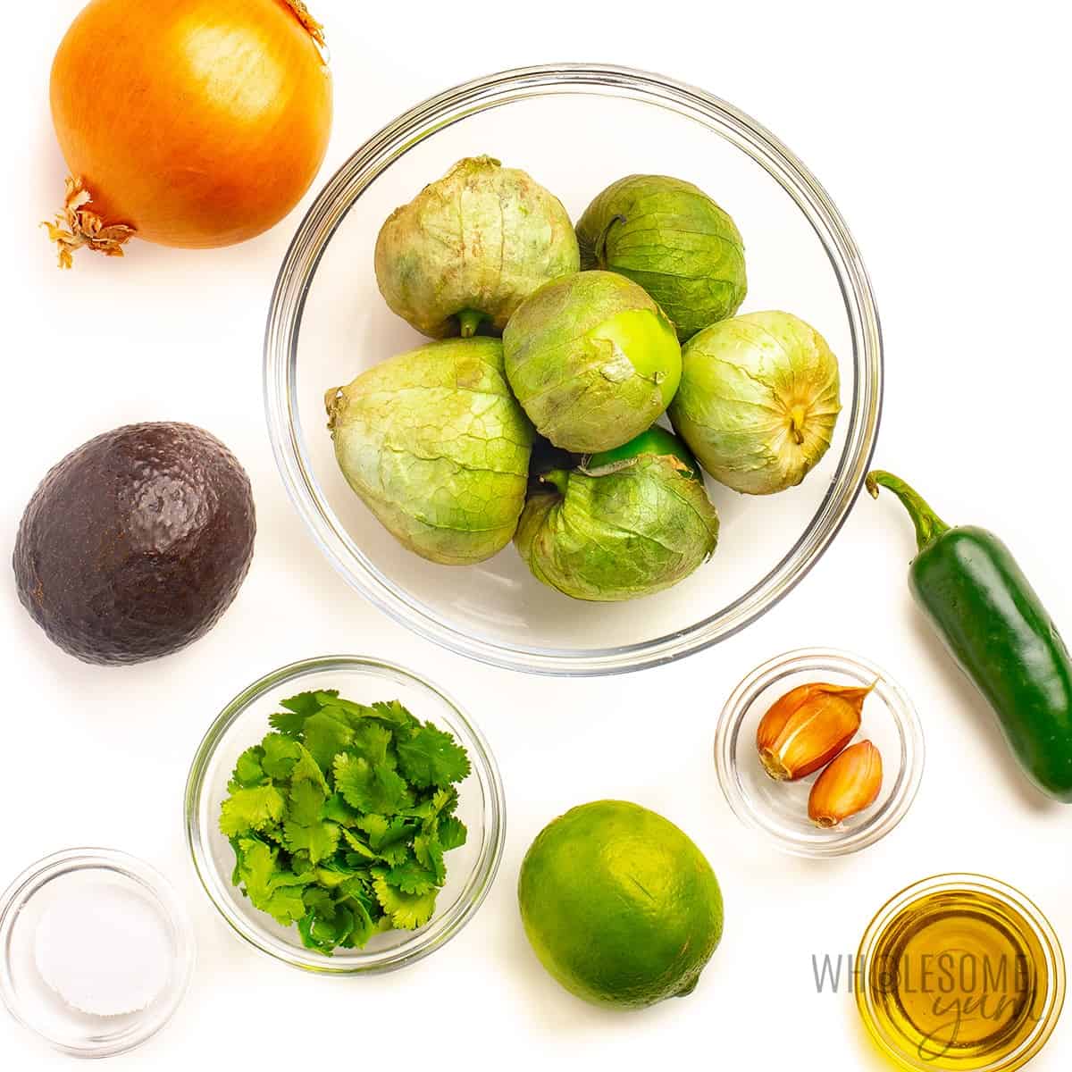 Avocado salsa verde ingredients in bowls.