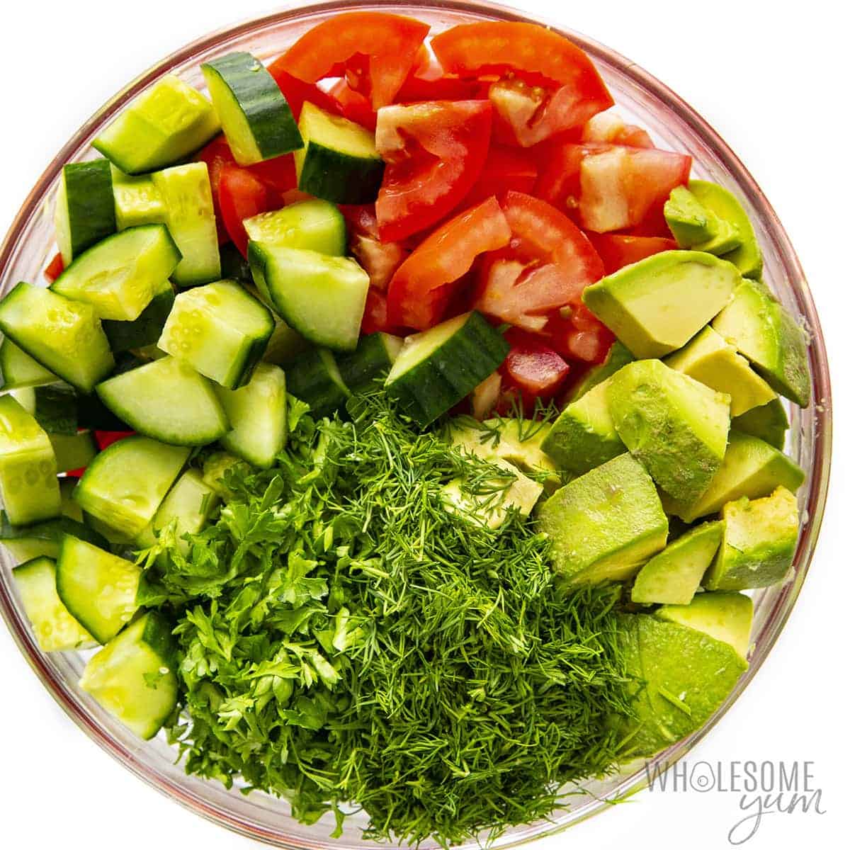 Cucumber tomato avocado salad in a bowl