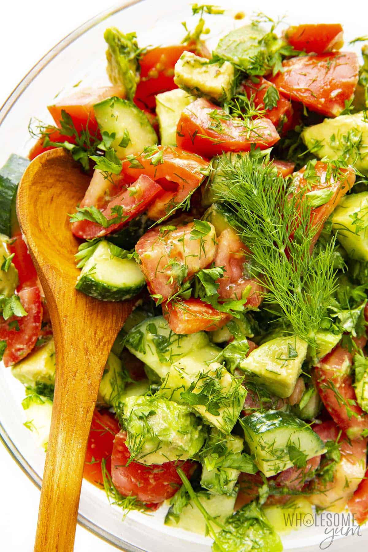 Salad with tomato, cucumber, and avocado in a bowl