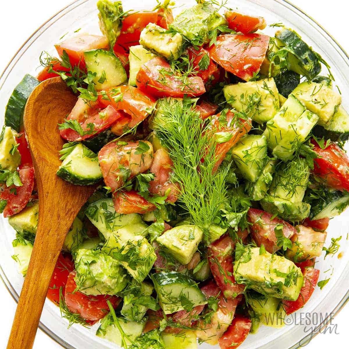 Cucumber tomato avocado salad in a bowl