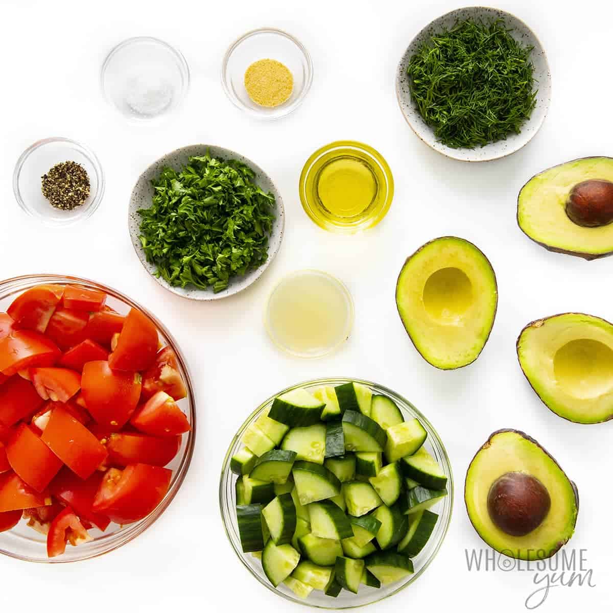 Ingredients to make cucumber tomato and avocado salad