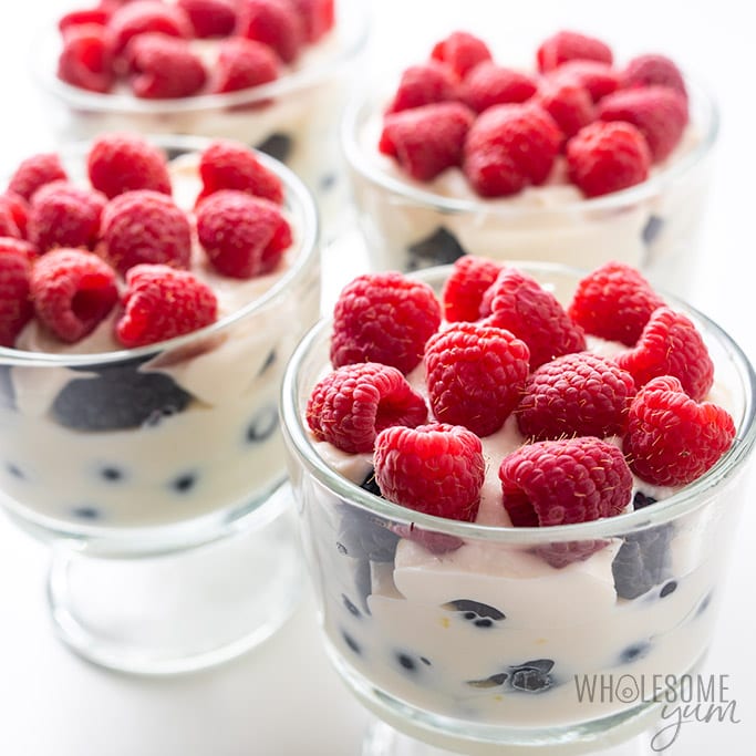 four trifle glasses with low carb ricotta cheese dessert and berries