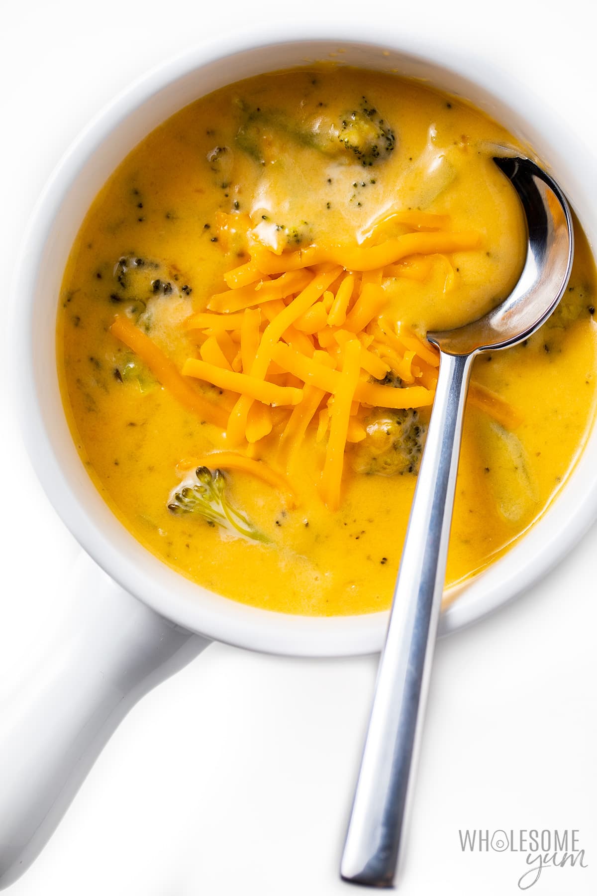 Broccoli cheese soup in a bowl with spoon.