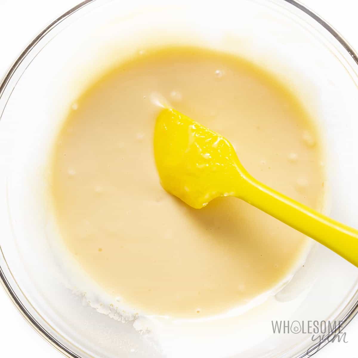 Condensed milk in a bowl with vanilla added.