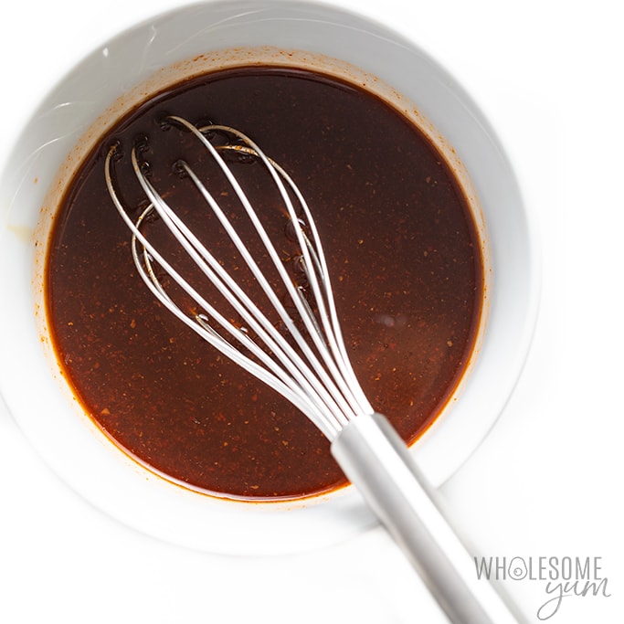 Thai beef salad dressing + marinade in a bowl with whisk