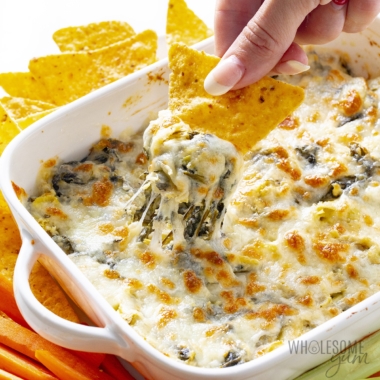 Spinach artichoke dip with cheese pull.