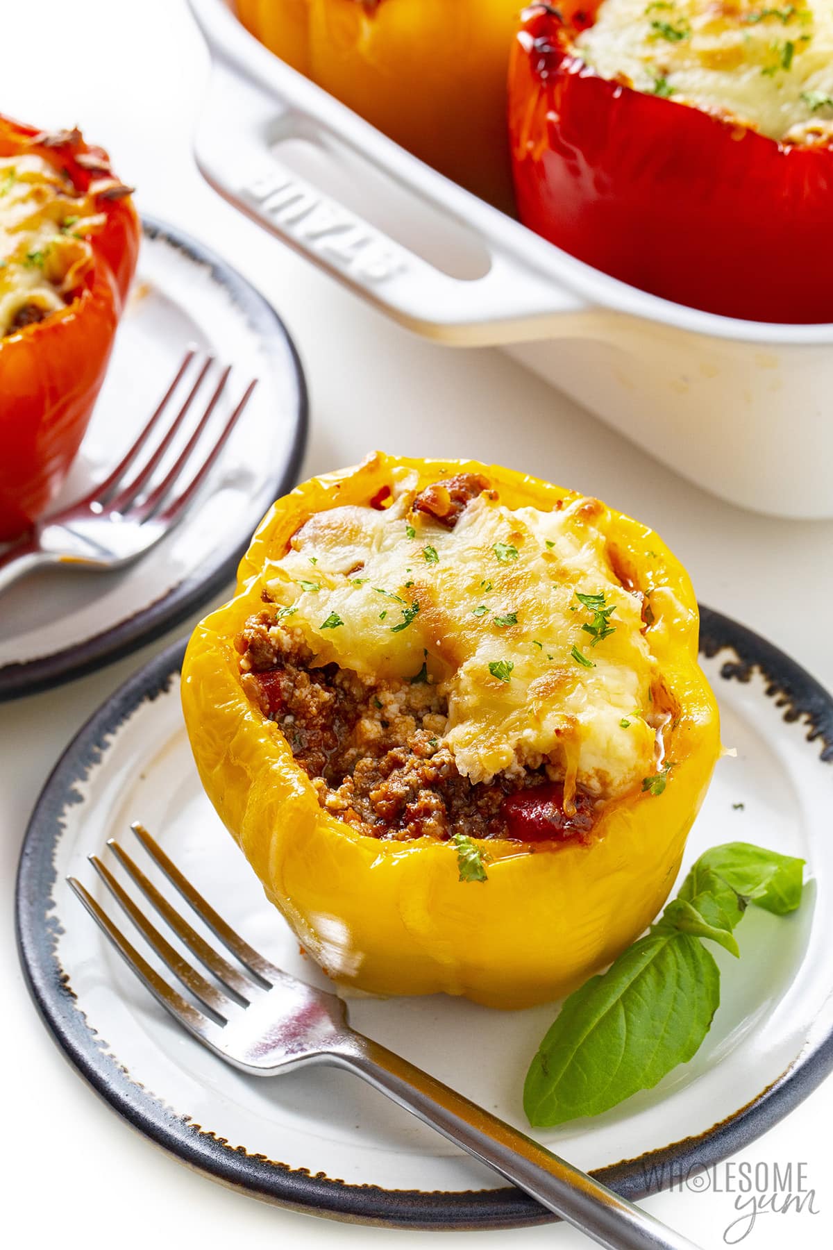 Low carb stuffed peppers with basil garnish.