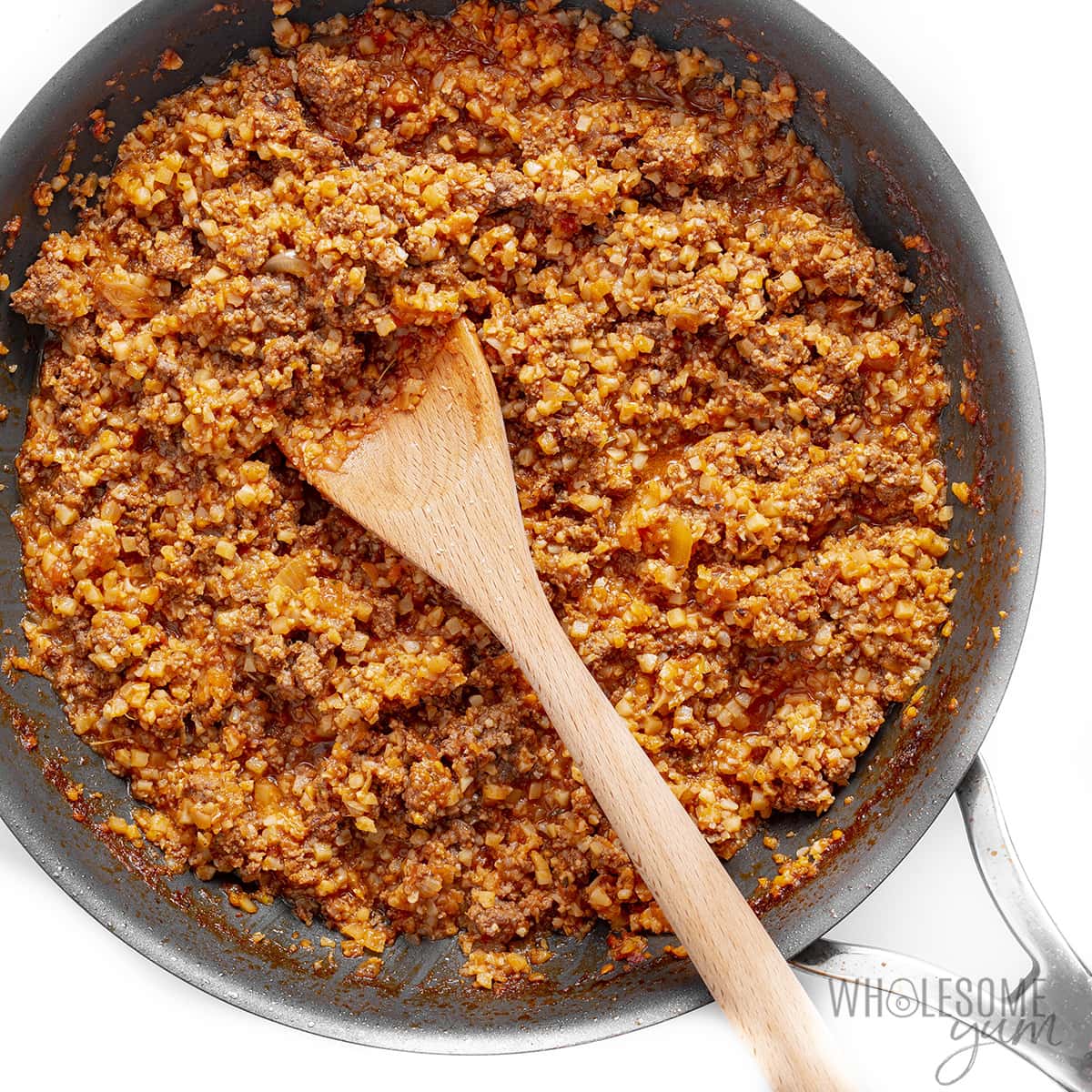 Ground beef and sauce mixture in a skillet.