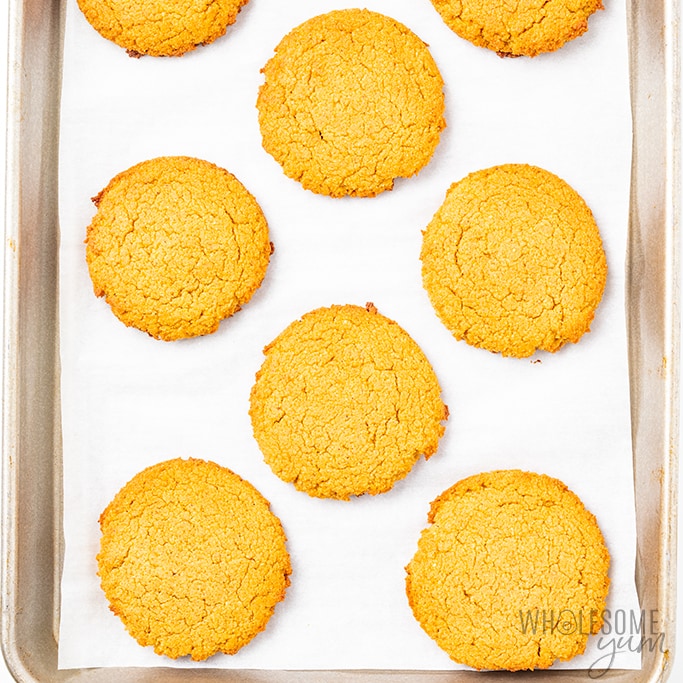 soft pumpkin cookies out of the oven on sheet pan