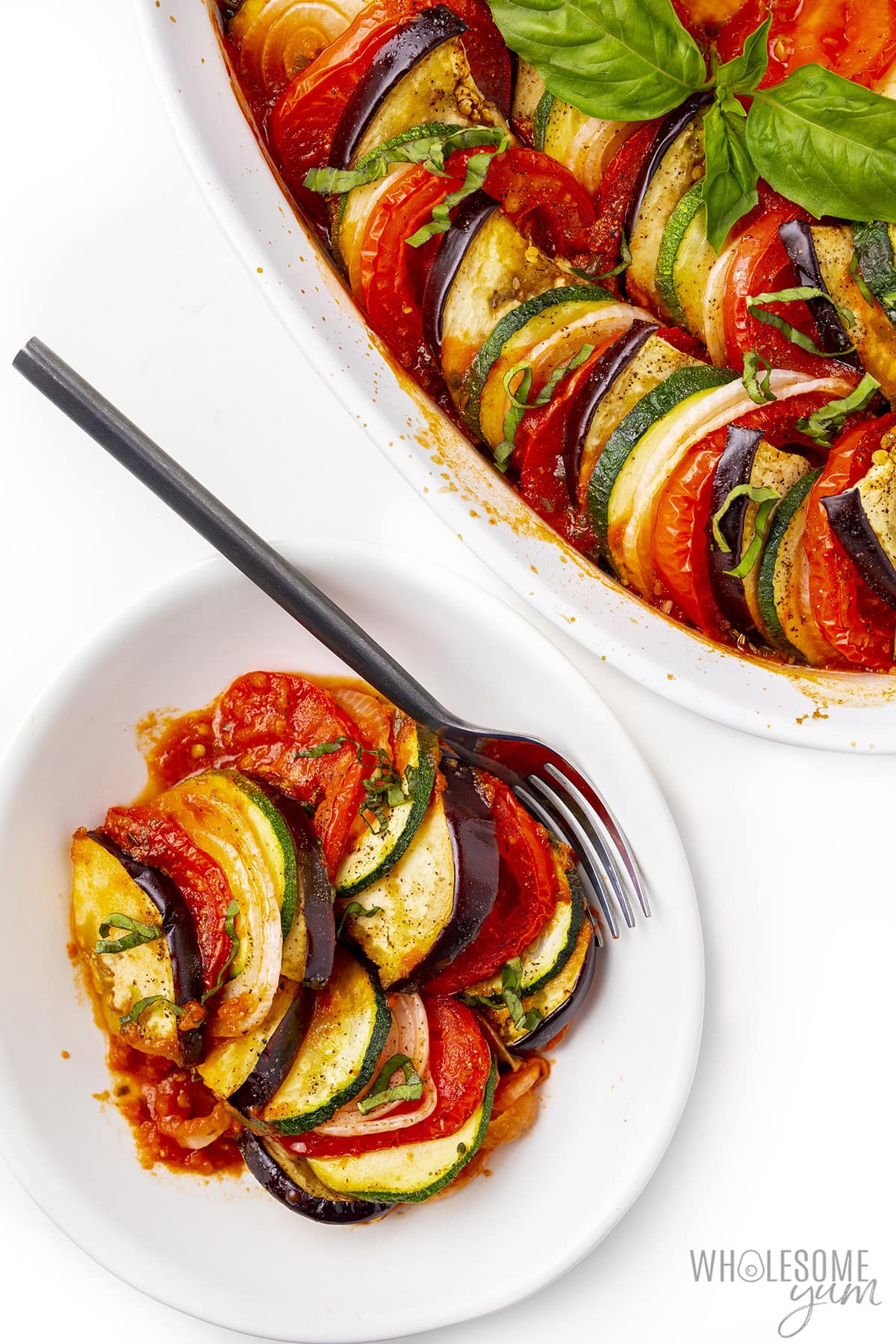 Ratatouille served up on a plate with a fork.