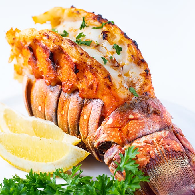 broiled lobster tail with parsley