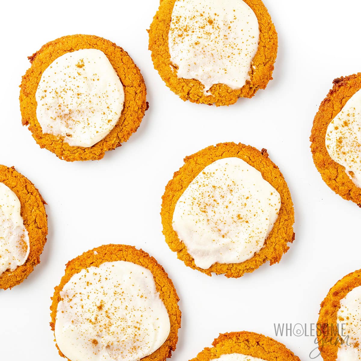 Gluten-free pumpkin cookies with vanilla glaze and cinnamon.