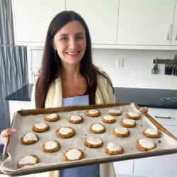 Maya with a pan of healthy pumpkin cookies.