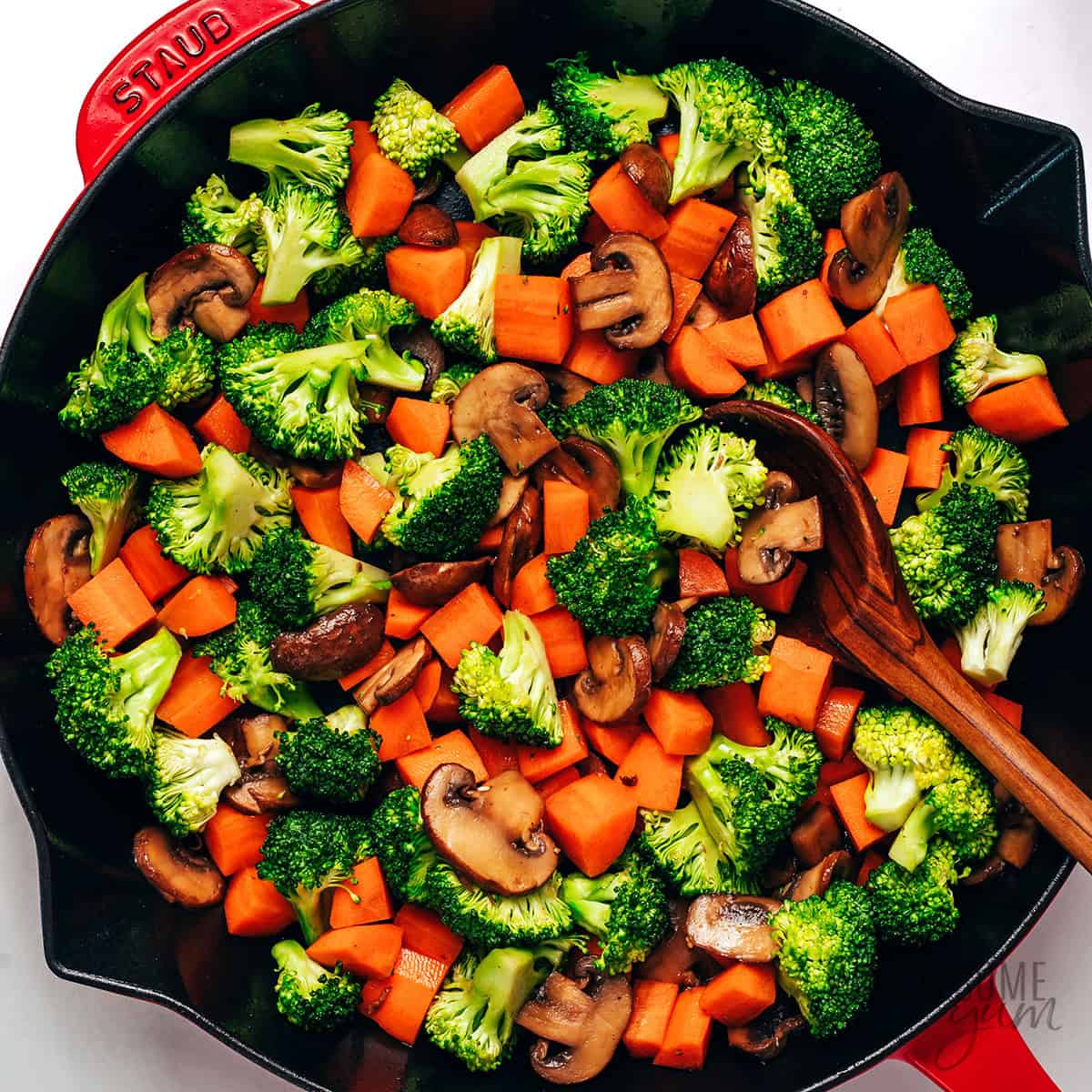 Stir frying vegetables in a skillet.