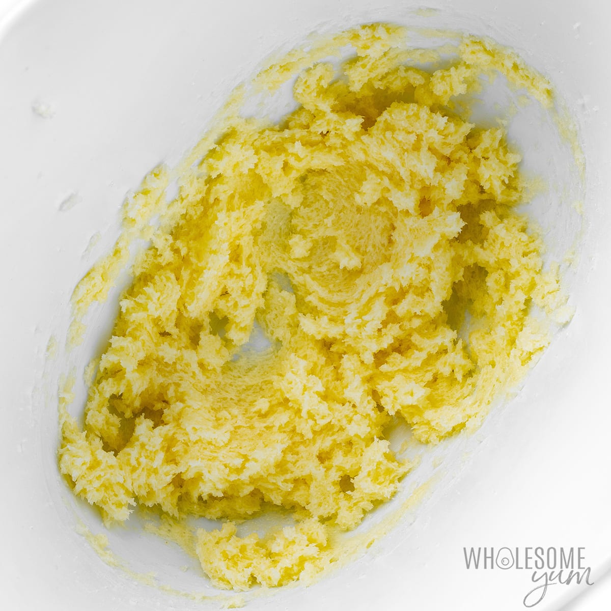 Butter and Besti beaten together in a mixing bowl.