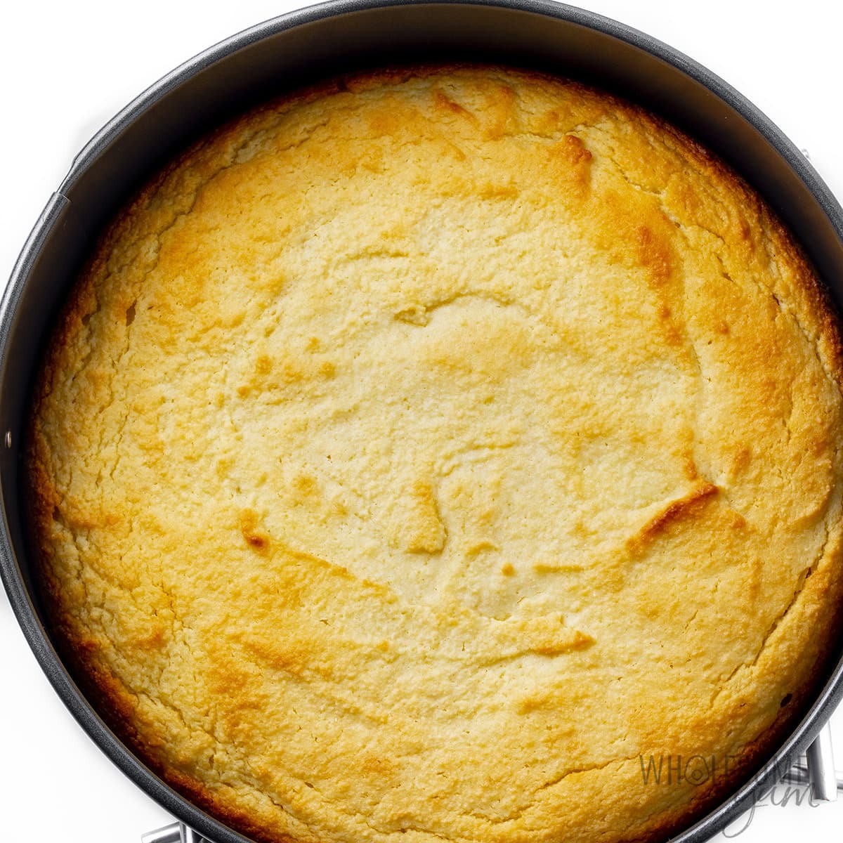 Baked almond cake in a springform pan.