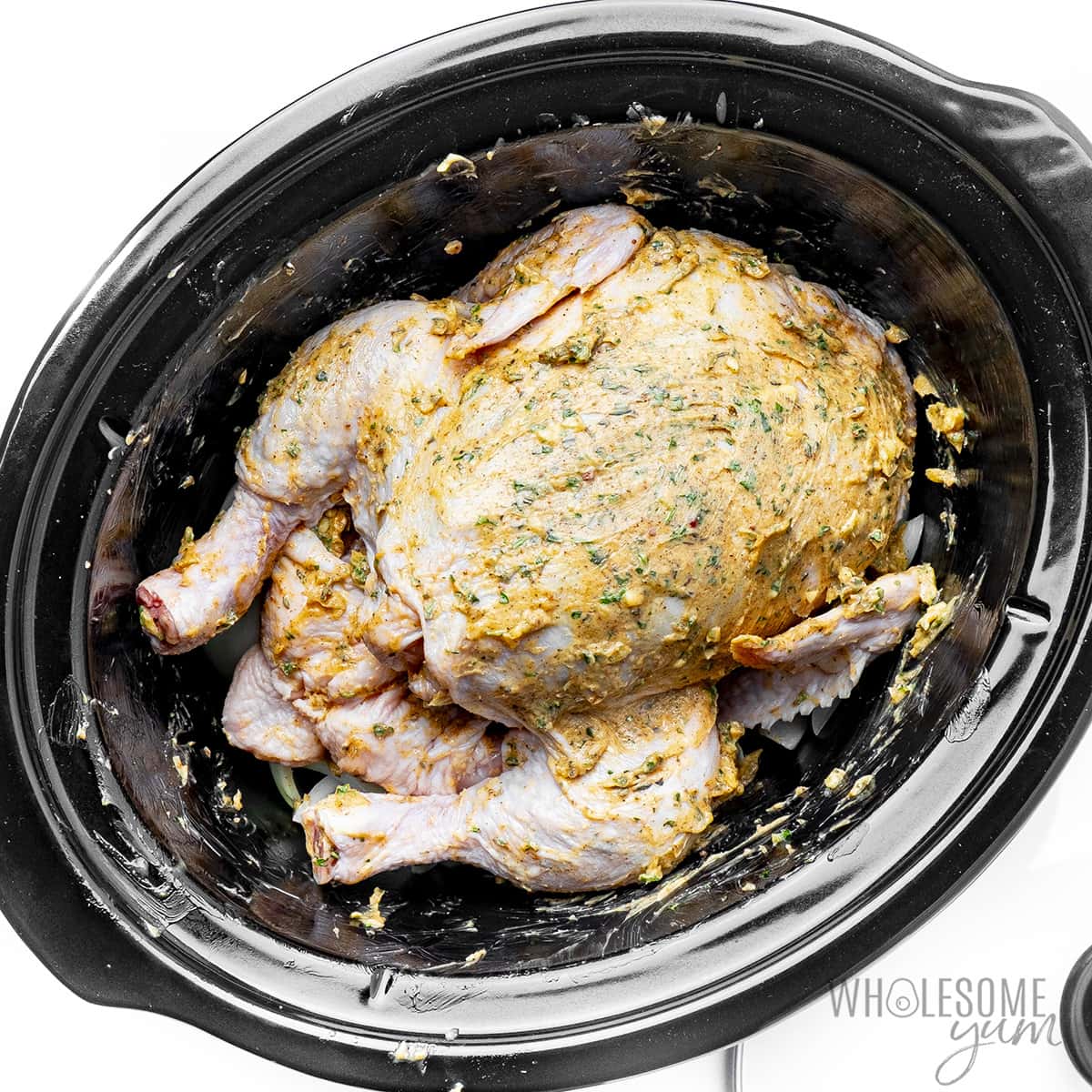 Butter mixture spread all over the whole chicken.