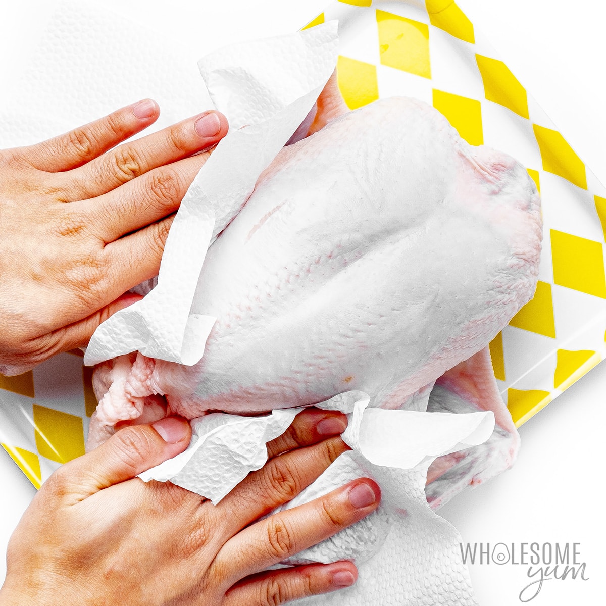 Whole chicken patted dry with paper towels.