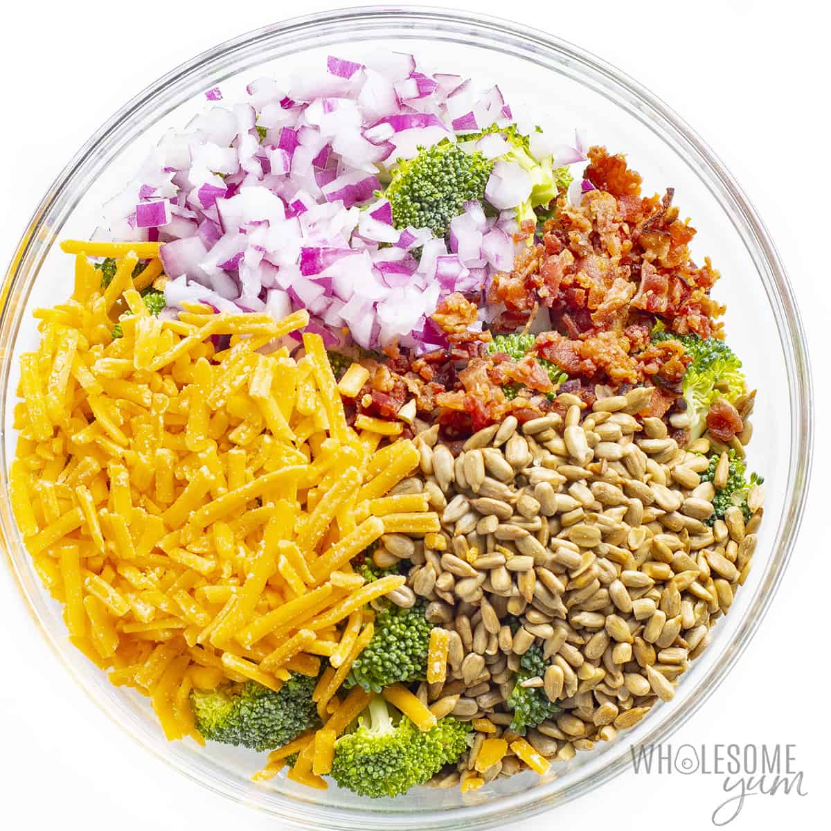 Keto broccoli salad ingredients in a bowl.