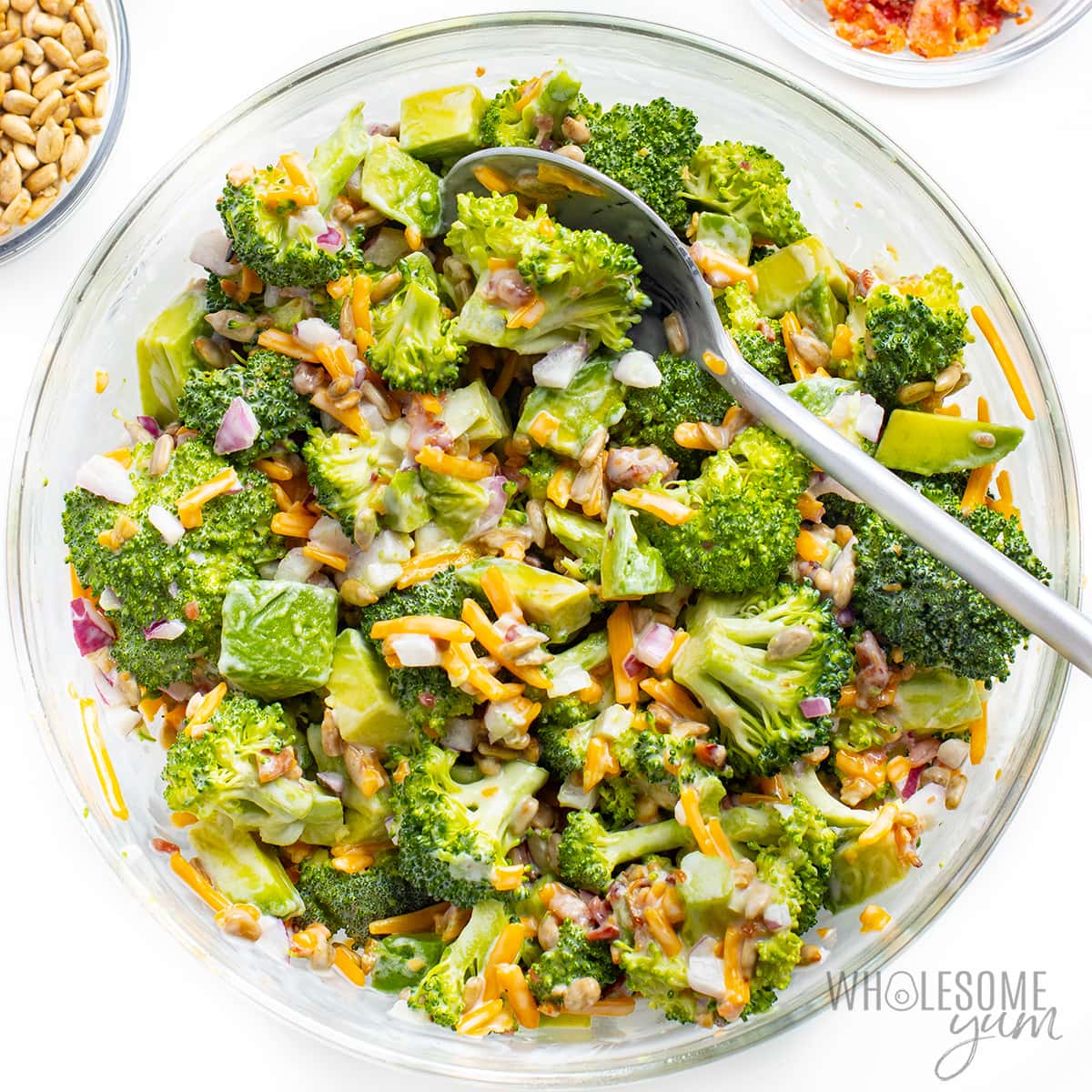 Bacon broccoli salad mixed together in a bowl.