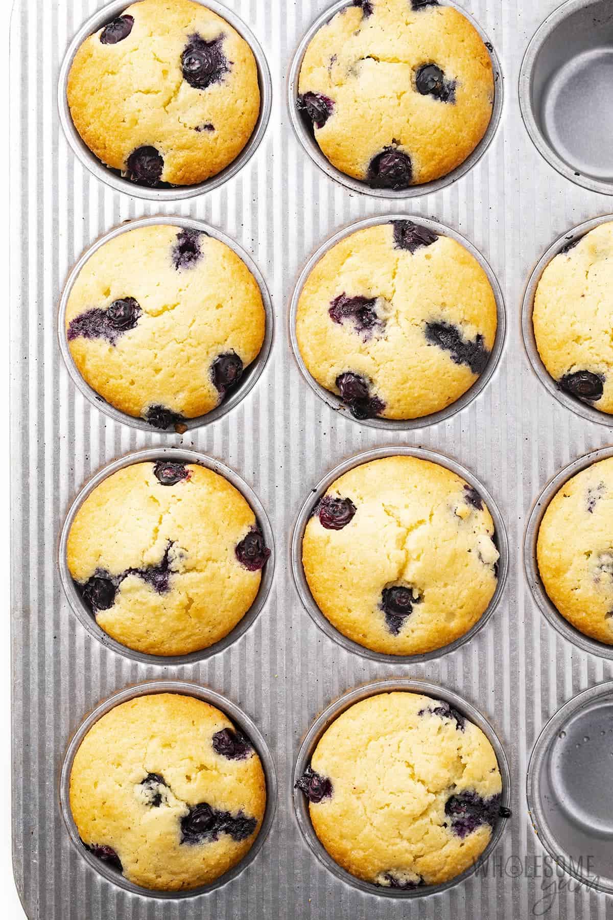 Almond flour blueberry muffins in muffin tin.
