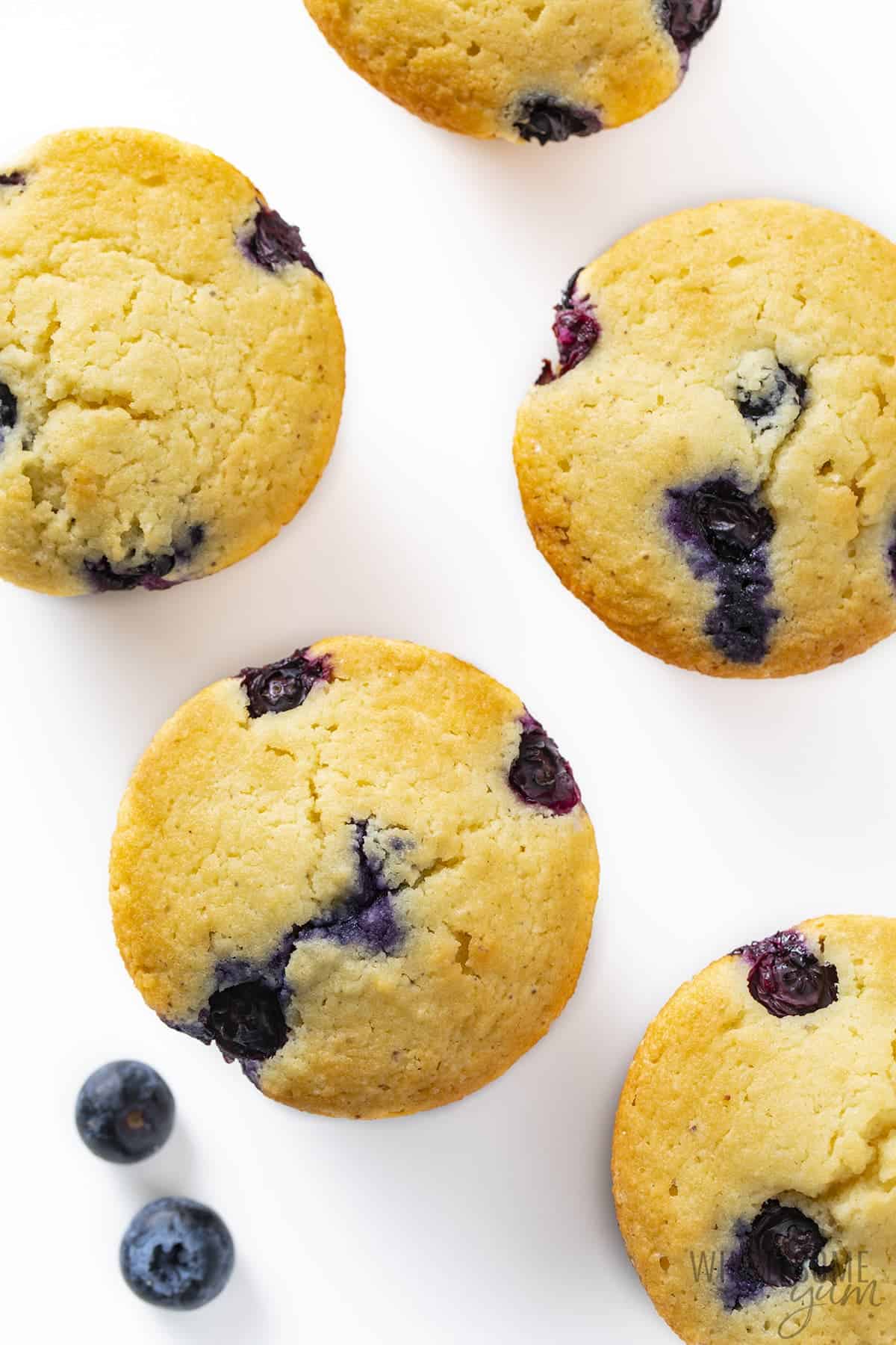 Low carb blueberry muffins on a white surface.