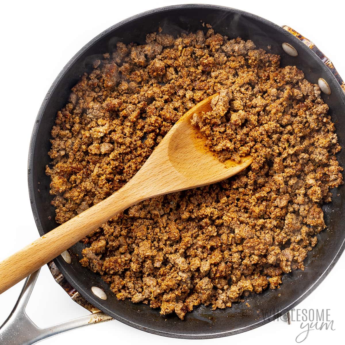 Ground beef browned in a skillet.