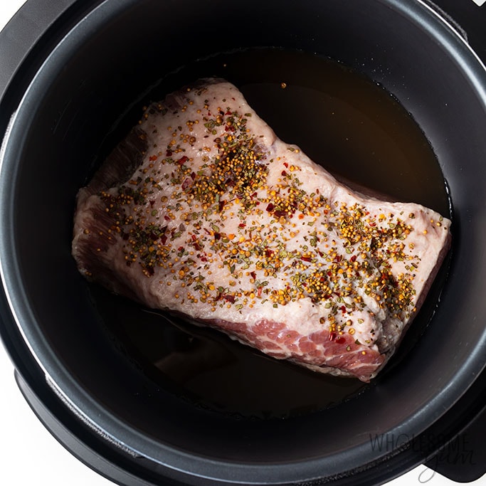 corned beef with seasoning in pressure cooker