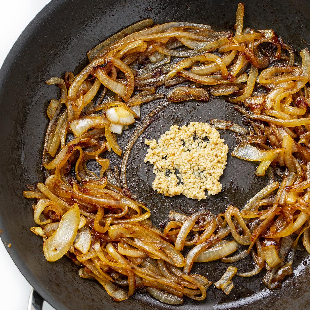 Fried onions and garlic in a skillet.