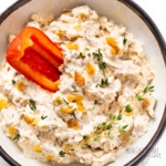 French onion dip in a bowl with a bell pepper.
