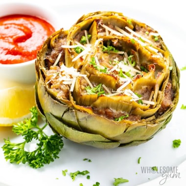 Stuffed artichokes on a white counter.