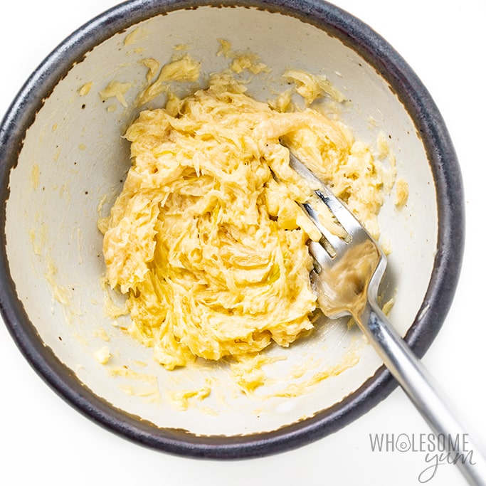 Mashed garlic butter in a bowl.